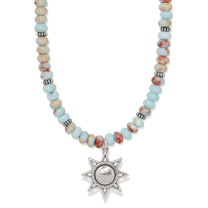 Brighton beaded necklace with turquoise and jasper beads and silver-plated star pendant on a white background
