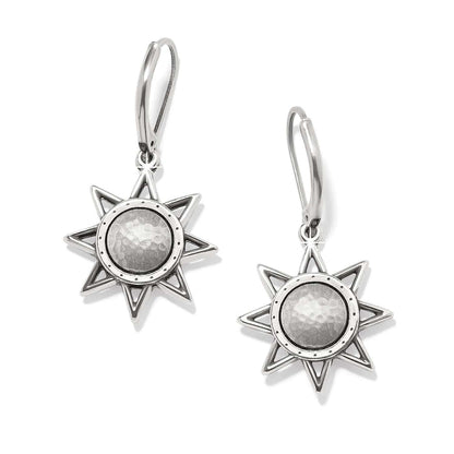 Brighton drop earrings with eight-point star design and hammered silver-plated centers with leverback hooks on a white background