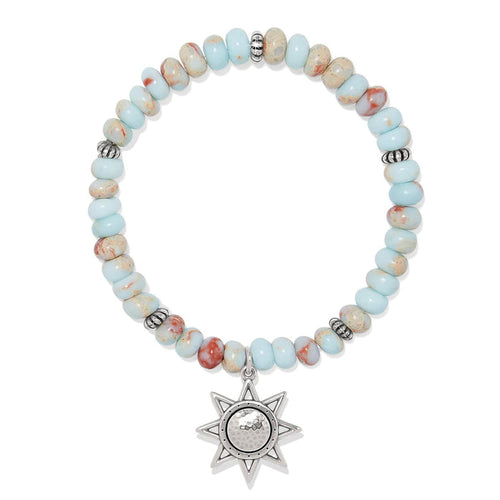 Brighton beaded bracelet with light blue and rust stone beads and silver-plated star charm on a white background