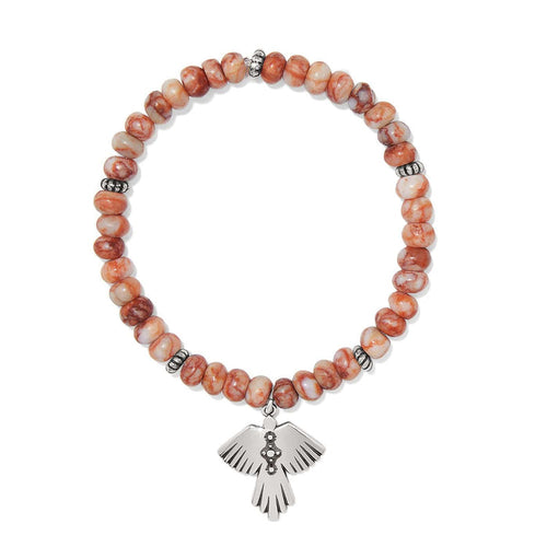 Brighton beaded stretch bracelet with red marbled beads and silver-plated thunderbird charm on a white background