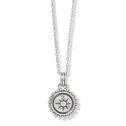 Brighton pendant necklace with silver-plated round sunburst medallion and beaded border on a white background
