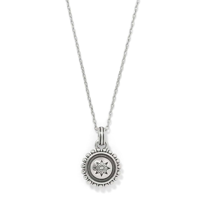 Brighton pendant necklace with silver-plated round medallion featuring star motif and beaded edge on a white background