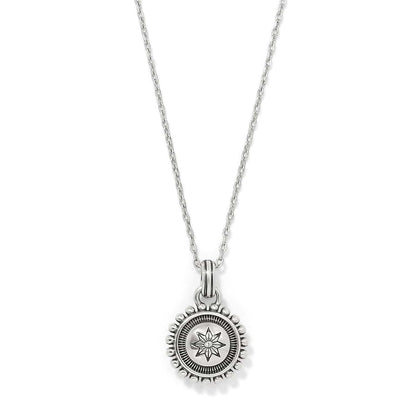 Brighton pendant necklace with silver-plated round medallion featuring star motif and beaded edge on a white background