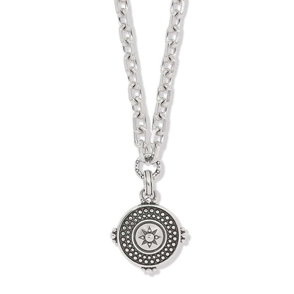 Brighton pendant necklace with silver-plated chain and round medallion featuring beaded border and star center on a white background