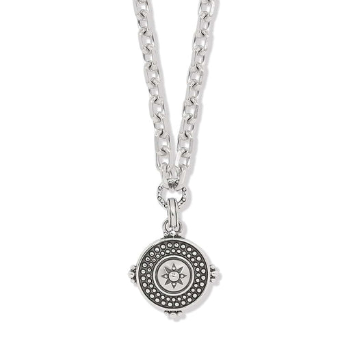 Brighton pendant necklace with silver-plated chain and round medallion featuring beaded border and star center on a white background