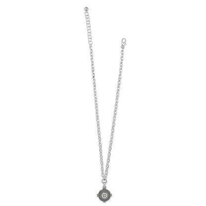 Brighton pendant necklace with silver-plated chain and round medallion featuring beaded border and star center on a white background