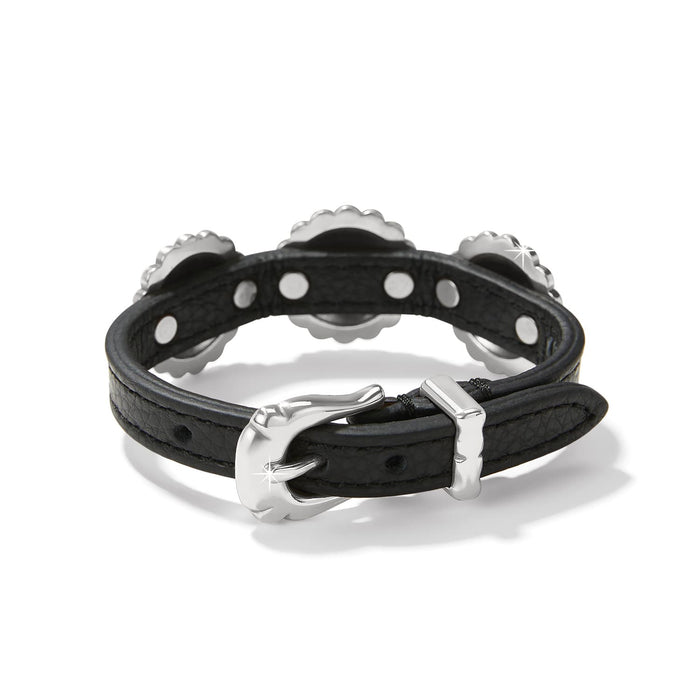 Brighton black leather bracelet shown from the back with silver-plated buckle closure and studded accents on a white background