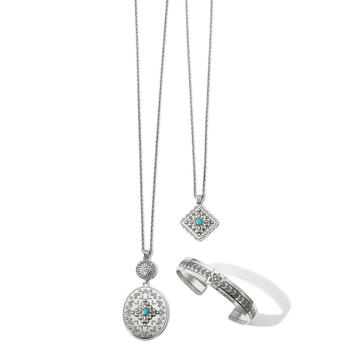 Brighton silver-plated jewelry set styled with medallion pendant necklaces and an engraved cuff bracelet with turquoise accents