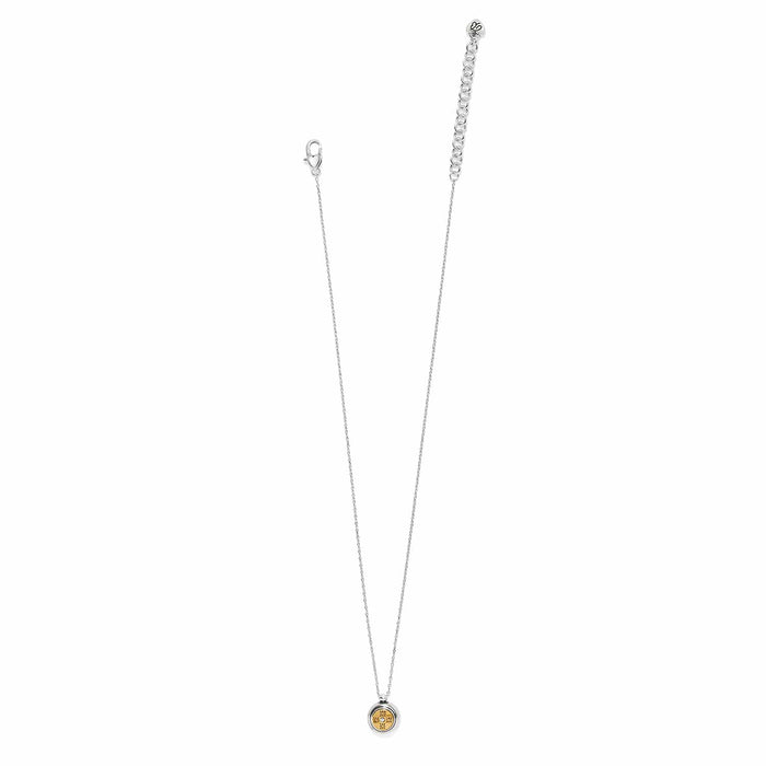 Brighton pendant necklace with two-tone circular charm, silver chain, and lobster clasp on a white background