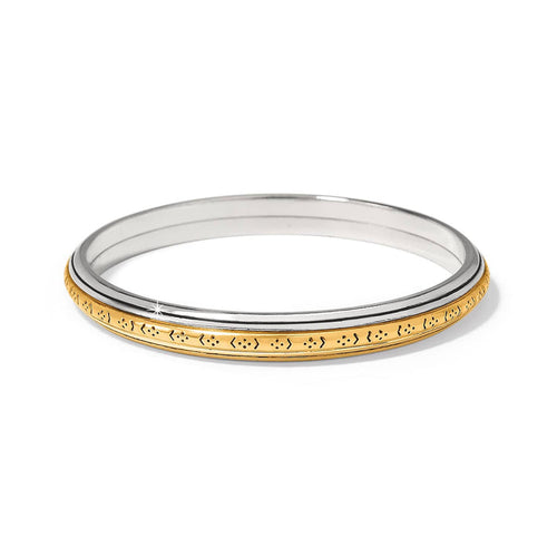 Brighton bangle bracelet with silver-tone inner band and engraved gold-tone outer band on a white background