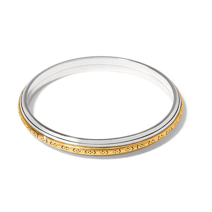 Brighton bangle bracelet with two-tone silver and gold finish featuring engraved patterned edge on a white background