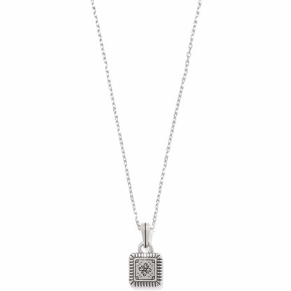 Brighton pendant necklace with small square silver-tone charm featuring engraved floral motif and ridged border on a white background