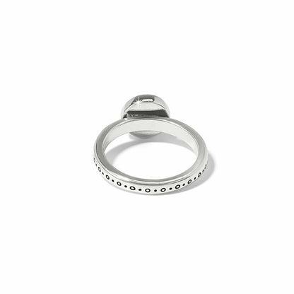 Brighton ring shown from the back with two tone band and dotted circle engraved detailing on a white background