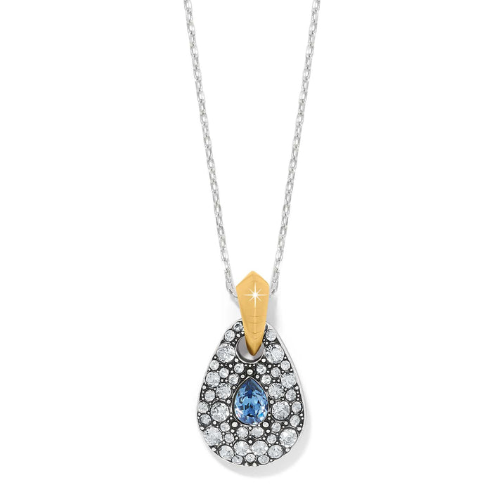 Brighton pendant necklace with teardrop shape, blue and clear crystals, and two-tone gold bail on a white background