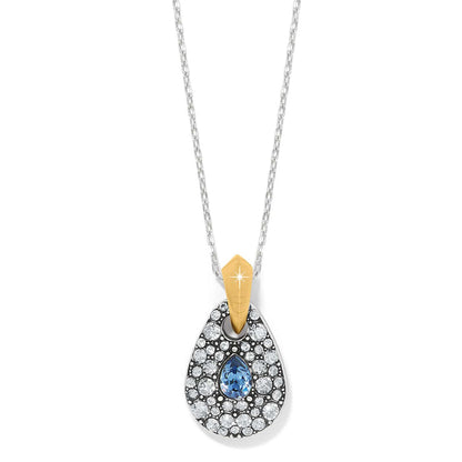 Brighton pendant necklace with teardrop shape, blue and clear crystals, and two-tone gold bail on a white background