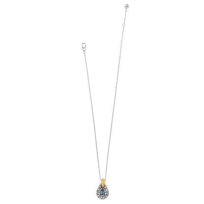 Brighton pendant necklace with two-tone teardrop charm, blue crystal center, and pavé crystal accents on a white background
