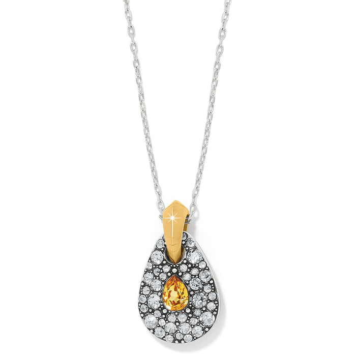 Brighton pendant necklace with teardrop shape, fine crystals, yellow center stone, and two-tone finish on a white background