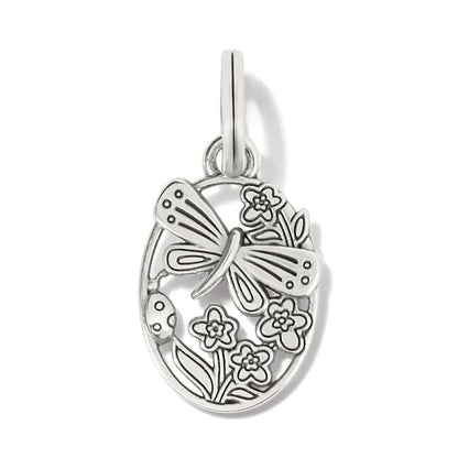 Brighton oval charm with silver-plated butterfly, flowers, and ladybug openwork design on a white background