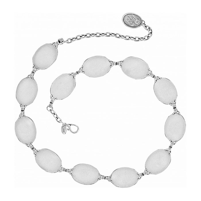 Brighton silver-tone belt with linked oval medallions and engraved oval charm on chain on a white background
