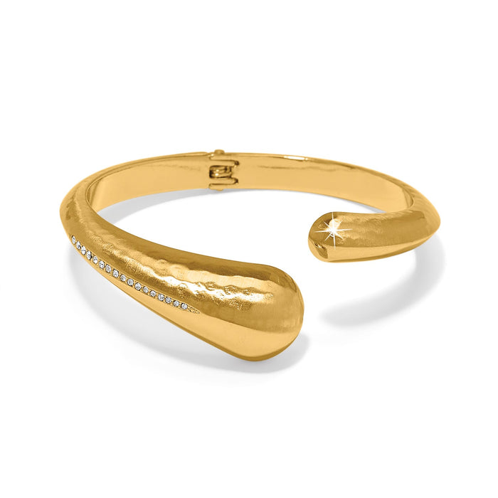 Brighton hinged cuff bracelet in gold-plated finish with hammered texture and crystal accent line on a white background