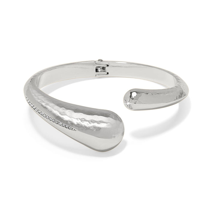 Brighton silver-plated hinged bangle bracelet with hammered finish and crystal accent along one side on a white background