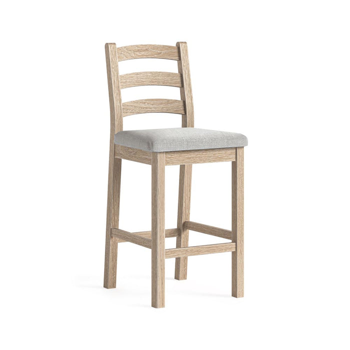 Wooden bar stool with a beige cushion on a white background