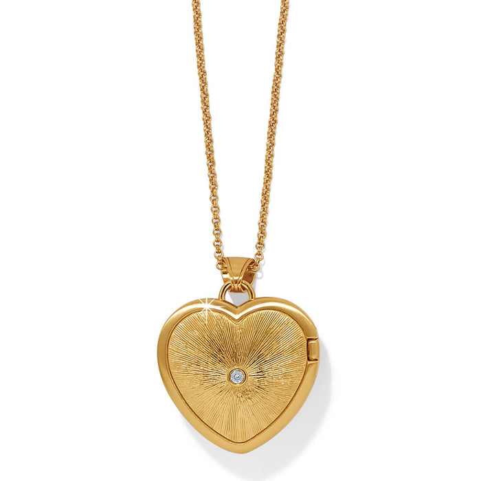 Brighton gold-plated heart locket necklace with sunburst texture and center crystal accent on a white background