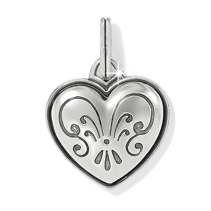 Brighton heart charm with silver-plated finish and engraved scroll fleur design on a white background