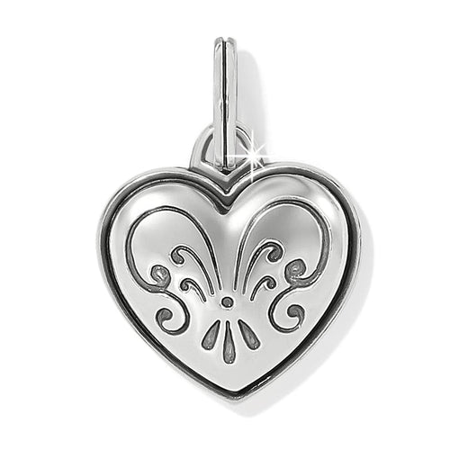 Brighton heart charm with silver-plated finish and engraved scroll fleur design on a white background