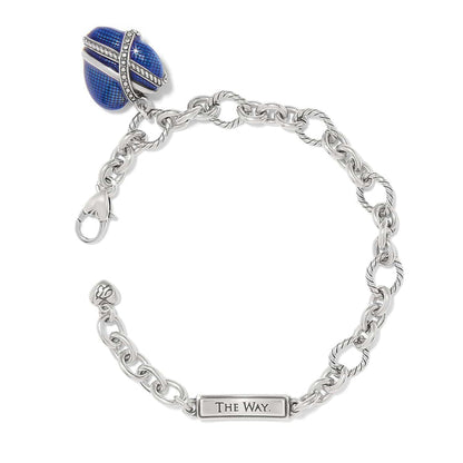 Brighton charm bracelet with blue enamel egg charm, crystal accents, silver-plated chain links, and engraved tag on a white background