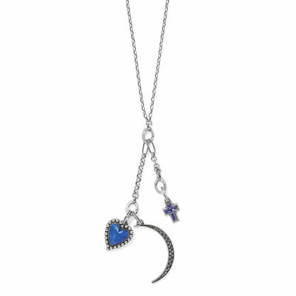 Brighton charm necklace with blue heart, crescent moon, and purple crystal cross pendants on a white background
