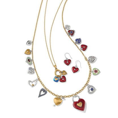 Brighton heart charm necklaces styled with matching enamel heart earrings and crystal accents on a white background