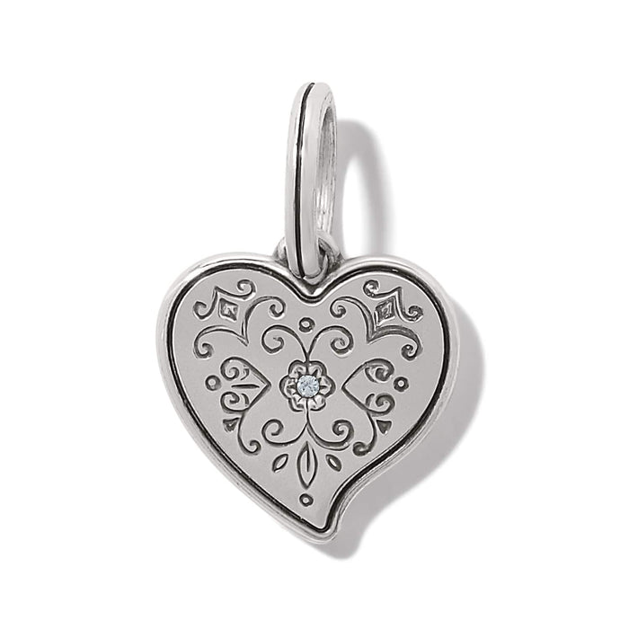 Brighton heart charm pendant with engraved scrollwork, silver-plated finish, and center crystal accent on a white background