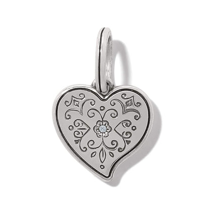 Brighton heart charm pendant with engraved scrollwork, silver-plated finish, and center crystal accent on a white background