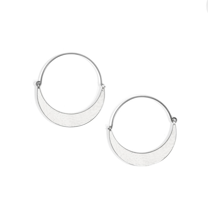 Brighton hoop earrings with silver-tone crescent shapes and hammered finish on thin wire hoops on a white background