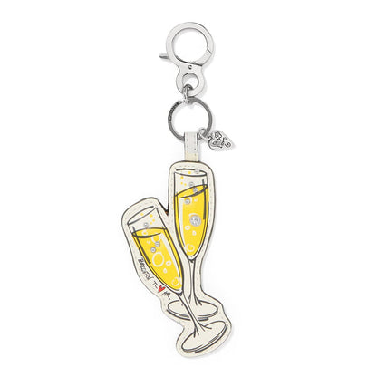 Brighton leather bag charm shaped like two champagne flutes with crystal accents and silver-tone clasp on a white background