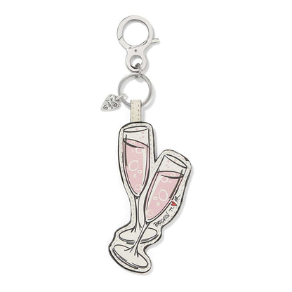 Brighton leather keychain shaped like two pink champagne flutes with silver-tone clasp and ring on a white background