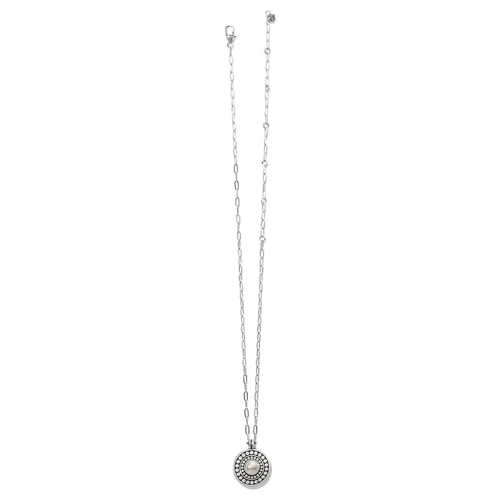 Brighton pendant necklace with glass pearl cabochon, beaded two-tone circular pendant, and delicate chain on a white background
