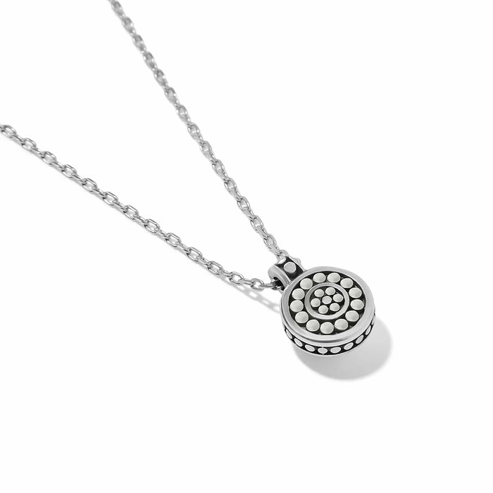 Brighton pendant necklace with silver-plated round medallion featuring dotted circular pattern and cable chain on a white background