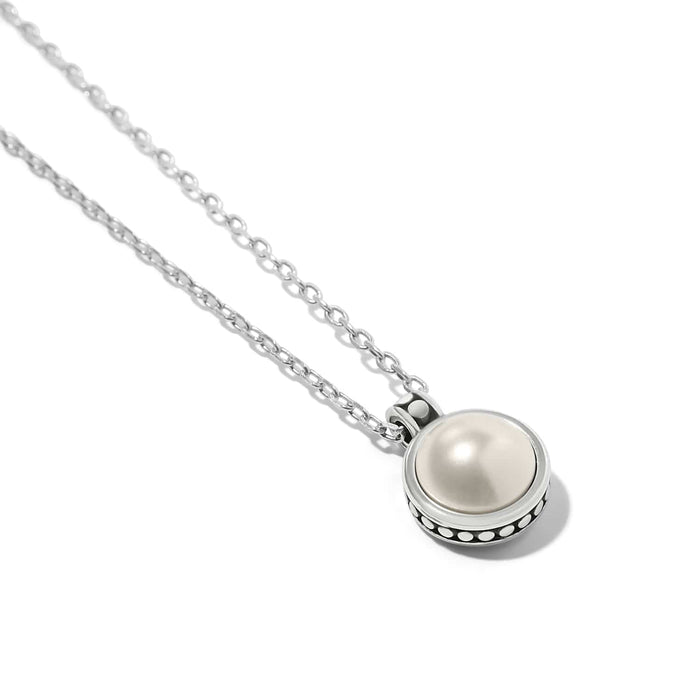 Brighton pendant necklace with glass pearl cabochon and silver-plated beaded border on a white background