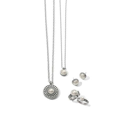 Brighton jewelry set styled with silver-plated pearl necklaces, matching stud earrings, and rings on a white background
