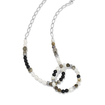 Brighton silver-plated chain necklace with black, pearl, and gray stone beads and decorative accents on a white background