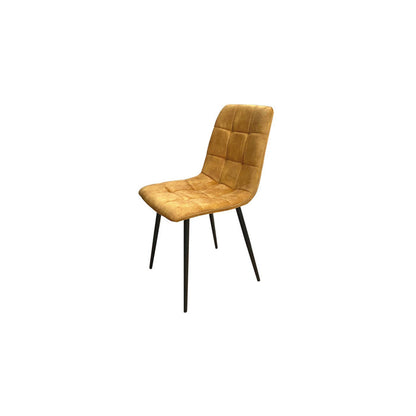 Yellow velvet dining chair with black legs on a white background