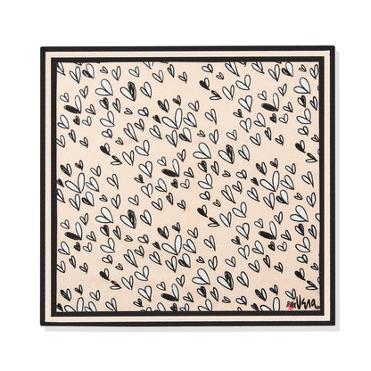 Brighton scarf with black and white hand-drawn heart print on a beige background, framed by black borders