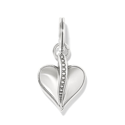 Brighton heart charm with silver-plated finish and beaded center detail down the middle on a white background