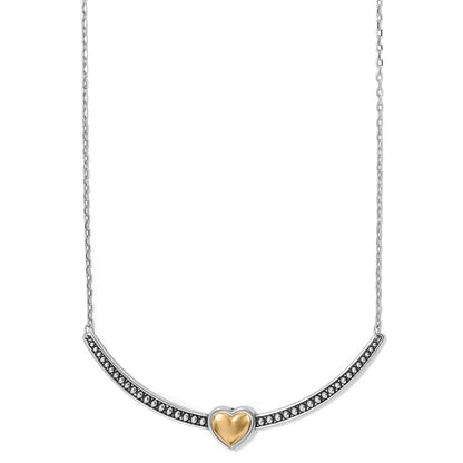 Brighton necklace with two-tone curved bar pendant featuring beaded silver-tone detail and gold-tone heart center on a white background