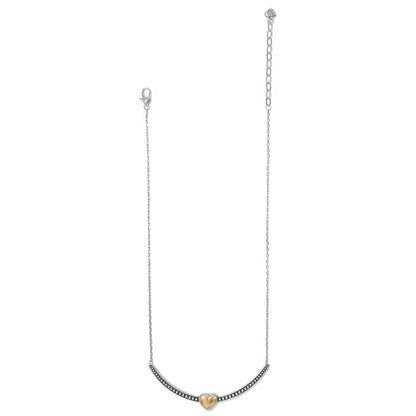 Brighton necklace with two-tone curved bar, gold heart center, and crystal accents on a white background