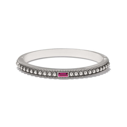 Brighton bangle bracelet with silver-plated beaded design and pink crystal baguette accent on a white background
