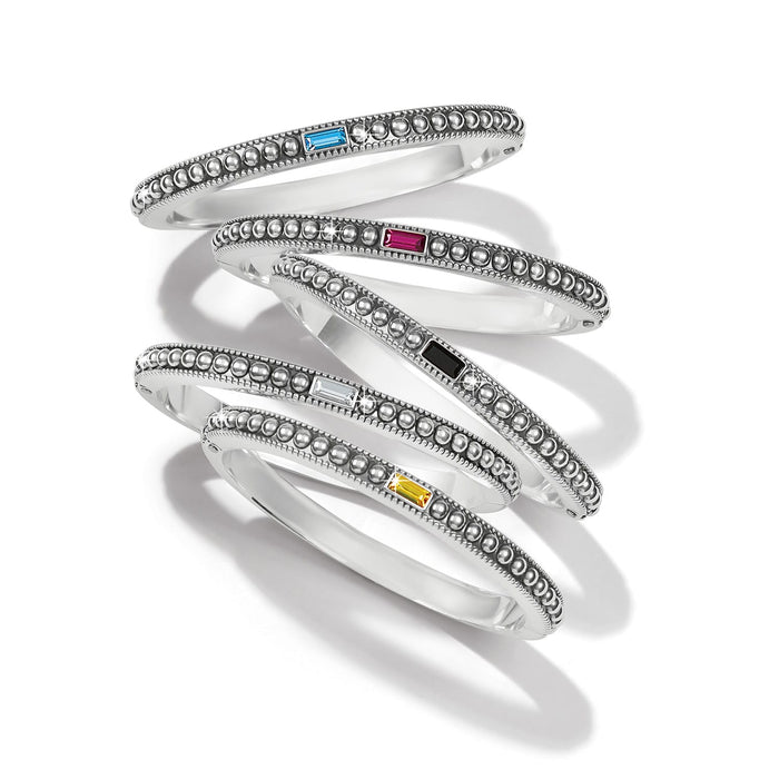 Brighton silver-plated bangle bracelets with beaded texture and blue, pink, black, clear, and yellow crystal accents on a white background