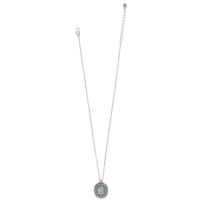Brighton silver-plated pendant necklace with beaded oval medallion and blue crystal baguette accent on a white background